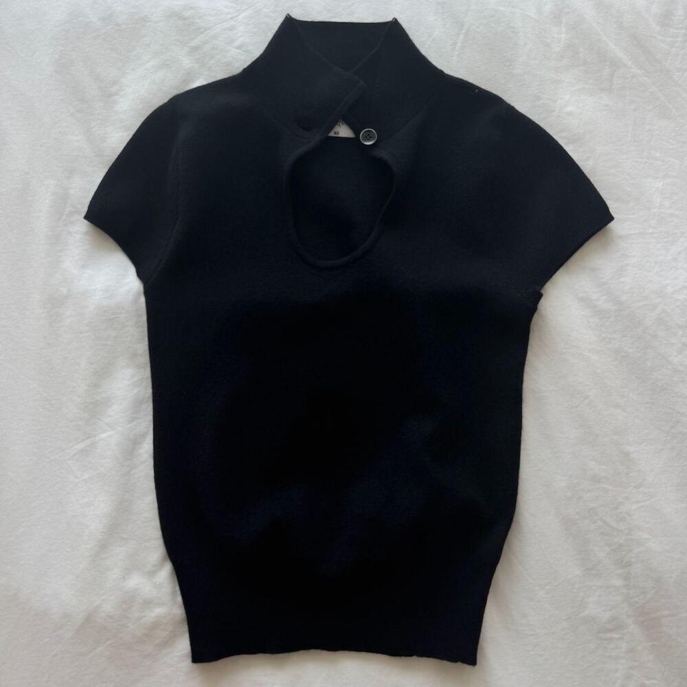 With jean oriental black knit top with keyhole cutout